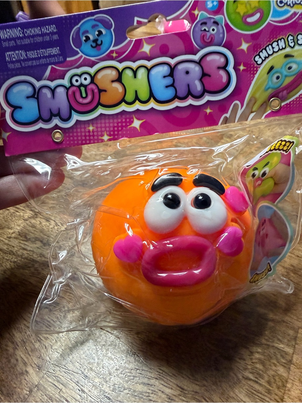 Usher Orange Squeeze Toy with Pink Facial Accents by Usher